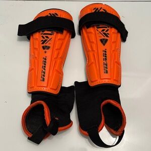 Vizari Orange Shin Guards with Black Straps